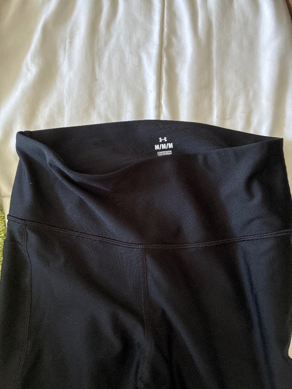 A pair of armor work out stretched pants